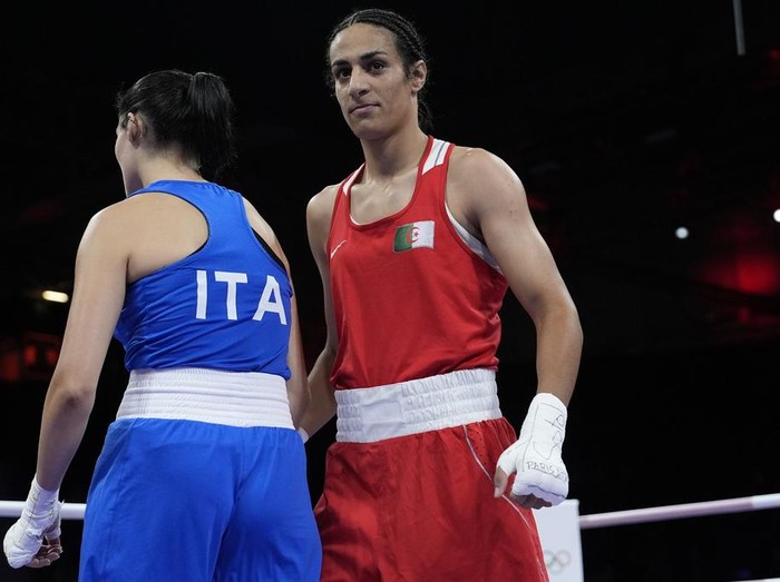 Algerias Imane Khelif, right, after defeating Italys Angela Carini, left, in their womens 66kg preliminary boxing match at the 2024 Summer Olympics, Thursday, Aug. 1, 2024, in Paris, France. (AP Photo/John Locher)