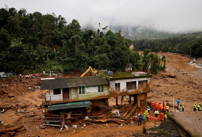 A drone view shows damaged houses at a landslide site after multiple landslides in the hills in Wayanad district, in the southern state of Kerala, India, August 1, 2024. REUTERS/Francis Mascarenhas