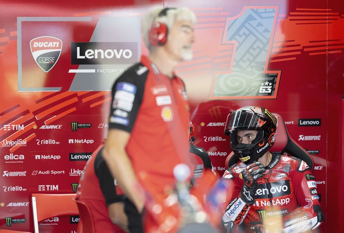 NORTHAMPTON, ENGLAND - AUGUST 02: Francesco Bagnaia of Italy and Ducati Lenovo Team looks on in box during the MotoGP Of Great Britain - Free Practice at Silverstone Circuit on August 02, 2024 in Northampton, England. (Photo by Mirco Lazzari gp/Getty Images)