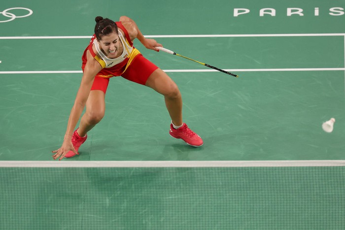 PARIS, FRANCE - AUGUST 04: Carolina Marin of Team Spain appears to suffer ani during the Women's Singles Semifinal match against Bing Jiao He of Team People's Republic of China on day nine of the Olympic Games Paris 2024 at Porte de La Chapelle Arena on August 04, 2024 in Paris, France. (Photo by Michael Reaves/Getty Images)