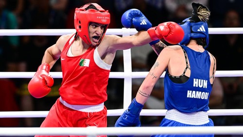 VILLEPINTE, FRANCE - AUGUST 3: Imane Khelif (red) of Team Algeria competes against Anna Luca Hamori (blue) of Team Hungary in the womens 66kg quarter-final boxing match during the Paris 2024 Olympic Games at the North Paris Arena, in Villepinte, France on August 3, 2024. Khelif wins the match and advanced to semi-finals. (Photo by Mehmet Murat Onel/Anadolu via Getty Images)