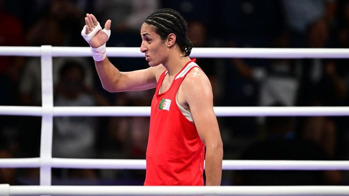 VILLEPINTE, FRANCE - AUGUST 3: Imane Khelif (red) of Team Algeria competes against Anna Luca Hamori (blue) of Team Hungary in the womens 66kg quarter-final boxing match during the Paris 2024 Olympic Games at the North Paris Arena, in Villepinte, France on August 3, 2024. Khelif wins the match and advanced to semi-finals. (Photo by Mehmet Murat Onel/Anadolu via Getty Images)