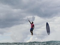 TOPSHOT - Brazils Gabriel Medina reacts after getting a large wave in the 5th heat of the mens surfing round 3, during the Paris 2024 Olympic Games, in Teahupoo, on the French Polynesian Island of Tahiti, on July 29, 2024. (Photo by Jerome BROUILLET / AFP) (Photo by JEROME BROUILLET/AFP via Getty Images)