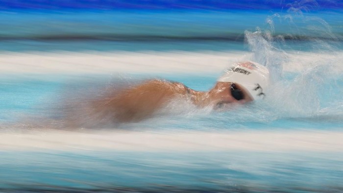 Katie Ledecky, of the United States, competes during a heat in the women's 1500-meter freestyle at the 2024 Summer Olympics, Tuesday, July 30, 2024, in Nanterre, France. (AP Photo/Ashley Landis)