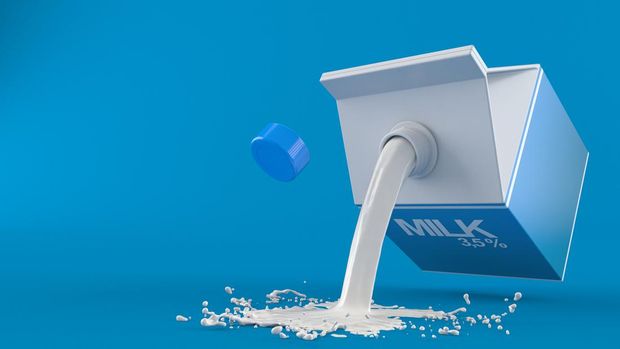 Spilled milk on blue background