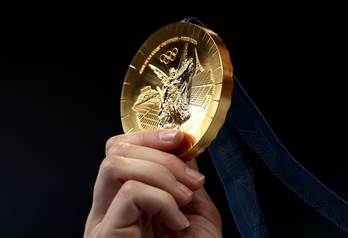 PARIS, FRANCE - AUGUST 02: A detailed view of the gold medal of Bryony Page of Team Great Britain during the medal ceremony for the Trampoline Gymnastics Womens Final on day seven of the Olympic Games Paris 2024 at Bercy Arena on August 02, 2024 in Paris, France. (Photo by Naomi Baker/Getty Images)