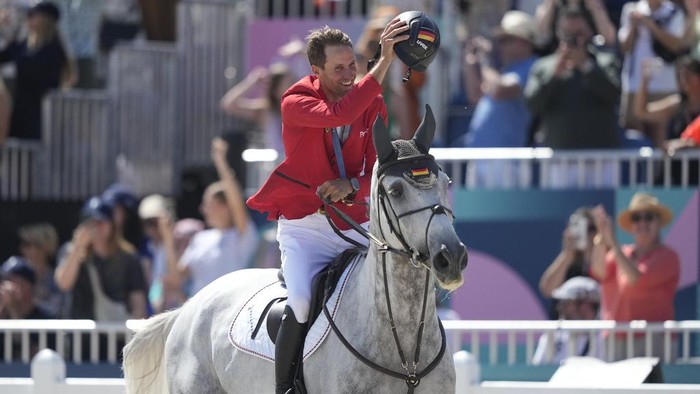 Christian Kukuk, Checker 47 Germany's Christian Kukuk wearing his gold medal rides Checker 47 after the Jumping Individual final at the 2024 Summer Olympics, Tuesday, Aug. 6, 2024, in Versailles, France. (AP Photo/Mosa'ab Elshamy)