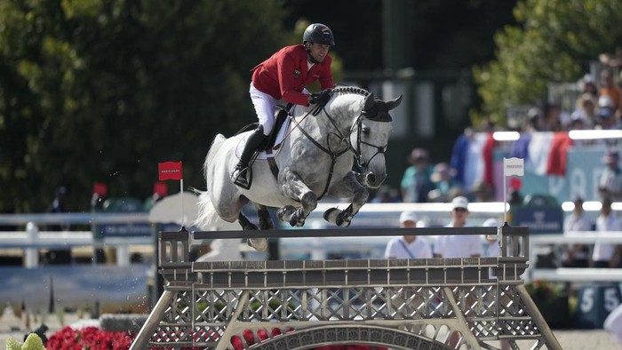 Germany's Christian Kukuk rides Checker 47 during the Jumping Individual final at the 2024 Summer Olympics, Tuesday, Aug. 6, 2024, in Versailles, France. (AP Photo/Mosa'ab Elshamy)