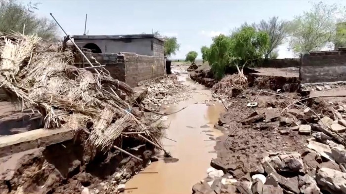 Drone footage shows people walking surrounded by flood waters, in Hodeidah Province, Yemen, August 7, 2024, in this screengrab taken from a handout video. Al Masirah TV/REUTERS TV via REUTERS THIS IMAGE HAS BEEN SUPPLIED BY A THIRD PARTY