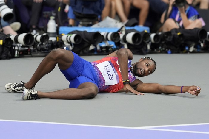 PARIS, FRANCE - AUGUST 08: Bronze medalist Noah Lyles of Team United States is taken off from the track with a wheelchair after competing in the Men's 200m Final on day thirteen of the Olympic Games Paris 2024 at Stade de France on August 08, 2024 in Paris, France. (Photo by Christian Petersen/Getty Images)