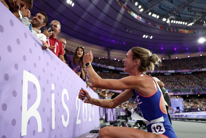 PARIS, FRANCE - AUGUST 06: Alice Finot of Team France applauds fans after competing in the Womens 3000m Steeplechase final on day eleven of the Olympic Games Paris 2024 at Stade de France on August 06, 2024 in Paris, France. (Photo by Hannah Peters/Getty Images)