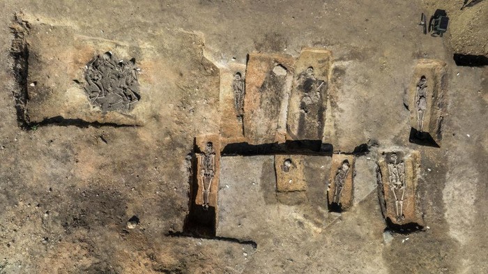 01 August 2024, Saxony-Anhalt, Löbejün: Excavation manager Markus Fietzeck crouches at the grave site of a complete family with two adults and two children. Archaeologists have discovered a 1000-year-old Slavic settlement with a complete burial ground. 60 burials were uncovered in two rows. The excavations are taking place on the future SuedOstLink direct current line. Photo: Heiko Rebsch/dpa (Photo by Heiko Rebsch/picture alliance via Getty Images)
