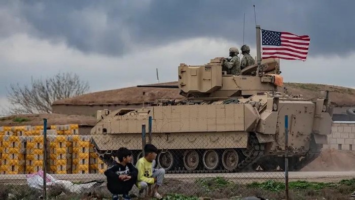 A US armored military vehicle drives on the outskirts of Rumaylan in Syrias northeastern Hasakeh province, bordering Turkey, on March 27, 2023. (File Photo: AFP)