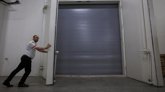 A laboratory technician works with donated blood at Magen David Adom's fortified underground blood services centre in Ramla, Israel, August 7, 2024. REUTERS/Ricardo Moraes