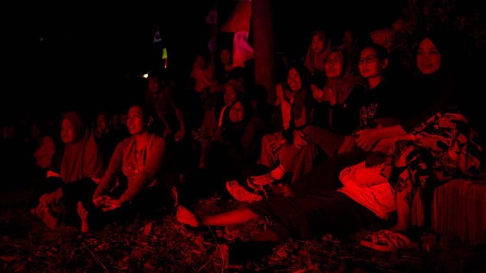 Villagers are watching a bodybuilding contest for tile factory workers as part of celebrating Indonesia Independence Day at Jebor Super Bambang, Jatiwangi in Majalengka, Indonesia, West Java province, on August 11, 2024. (Photo by Algi Febri Sugita/NurPhoto via Getty Images)