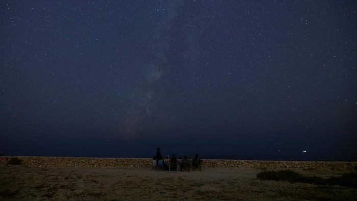 People look out for shooting stars as the moon sets during the annual Perseid meteor shower at Migra l-Ferha, outside the town of Rabat, Malta August 12, 2024. REUTERS/Darrin Zammit Lupi