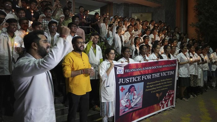 Junior doctors protest against the rape and murder of a medic in Kolkatta last week, at a candlelight vigil in Hyderabad, India, Monday, Aug. 12, 2024. (AP Photo/Mahesh Kumar A.)
