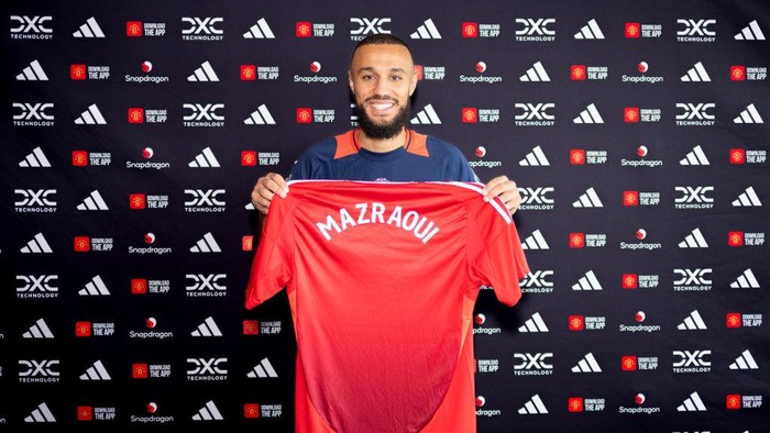 MANCHESTER, ENGLAND - AUGUST 13: (EXCLUSIVE COVERAGE) Noussair Mazraoui of Manchester United poses after signing for the club at Carrington Training Ground on August 13, 2024 in Manchester, England.  (Photo by Manchester United/Manchester United via Getty Images)