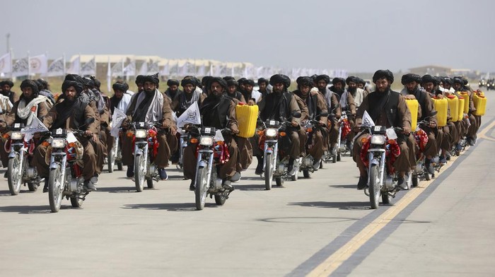 Taliban military vehicles take part in a military parade to mark the third anniversary of the withdrawal of U.S.-led troops from Afghanistan, in Bagram Air Base in the Parwan Province of Afghanistan, Wednesday, Aug. 14, 2024. (AP Photo/Siddiqullah Alizai)