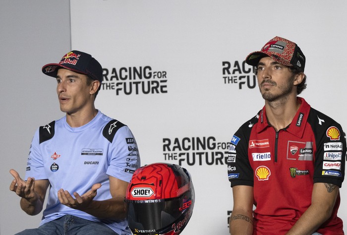 SPIELBERG, AUSTRIA - AUGUST 15:  Marc Marquez  (L) of Spain and Gresini Racing MotoGP speaks  and  Francesco Bagnaia of Italy and Ducati Lenovo Team looks on during the press conference pre-event during the MotoGP Of Austria - Previews at Red Bull Ring on August 15, 2024 in Spielberg, Austria. (Photo by Mirco Lazzari gp/Getty Images)