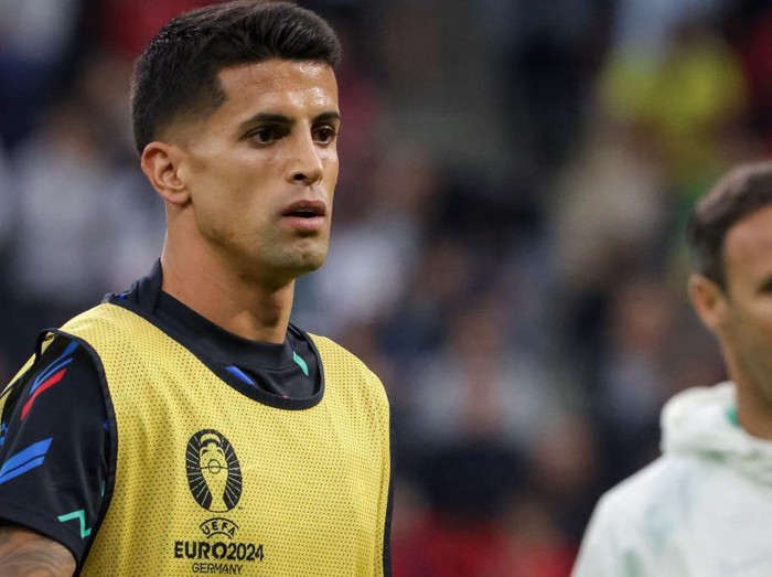 HAMBURG, GERMANY - JULY 05: Joao Cancelo of Portugal warming up before the UEFA EURO 2024 quarter-final match between Portugal and France at Volksparkstadion on July 05, 2024 in Hamburg, Germany. (Photo by Inaki Esnaola/Getty Images)