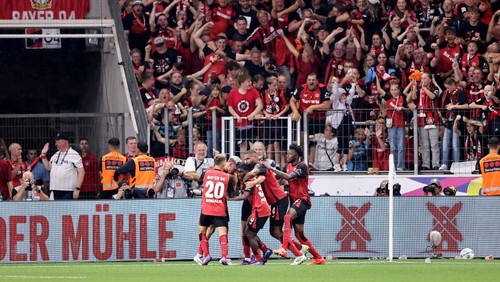 LEVERKUSEN, GERMANY - AUGUST 17: Patrik Schick of Bayer 04 Leverkusen (obscured) celebrates scoring his teams second goal with teammates during the DFL Supercup 2024 match between Bayer 04 Leverkusen and VfB Stuttgart on August 17, 2024 in Leverkusen, Germany. (Photo by Christof Koepsel/Getty Images)