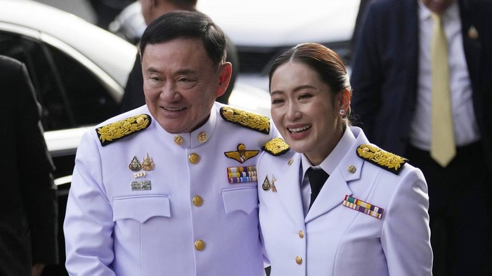 Thailand's new Prime Minister Paetongtarn Shinawatra talks to media members after receiving a royal letter of endorsement for the post at the Pheu Thai party headquarters in Bangkok, Thailand, Sunday, Aug. 18, 2024. (AP Photo/Sakchai Lalit)