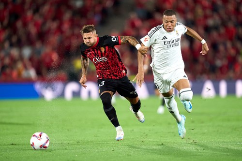 MALLORCA, SPAIN - AUGUST 18: Pablo Maffeo of RCD Mallorca competes for the ball with Kylian Mbappe of Real Madrid CF during the La Liga EA Sports match between RCD Mallorca and Real Madrid CF at Estadi de Son Moix on August 18, 2024 in Mallorca, Spain. (Photo by Mateo Villalba/Getty Images)