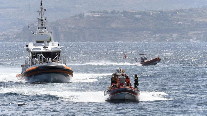 Emergency services at the scene of the search for a missing boat, in Porticello, southern Italy, Tuesday, Aug. 20, 2024. Rescue teams and divers returned to the site of a storm-sunken superyacht Tuesday to search for six people, including British tech magnate Mike Lynch, who are believed to be still trapped in the hull 50 meters (164-feet) underwater. (AP Photo/Salvatore Cavalli)
