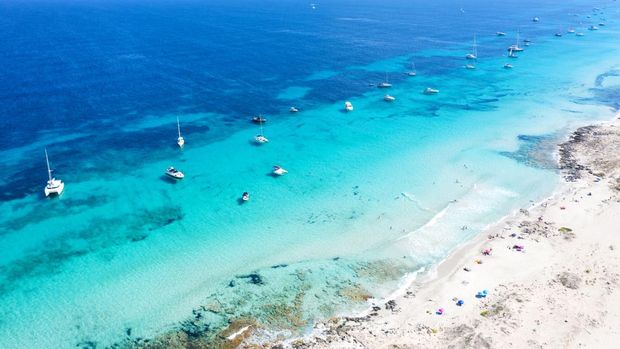 People sunbathing in Illetes, Formentera - Spain