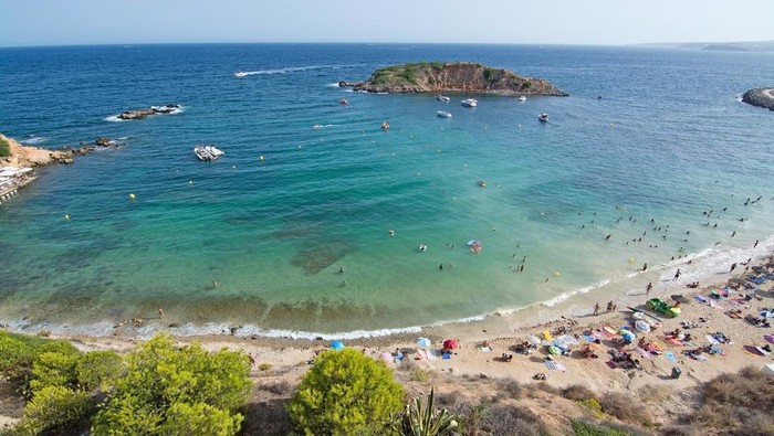 People sunbathing in Illetes, Formentera - Spain