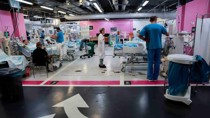 Medical professionals work at an underground emergency hospital in a parking lot at Rambam Health Care Campus, in Haifa, northern Israel August 1, 2024. REUTERS/Ammar Awad