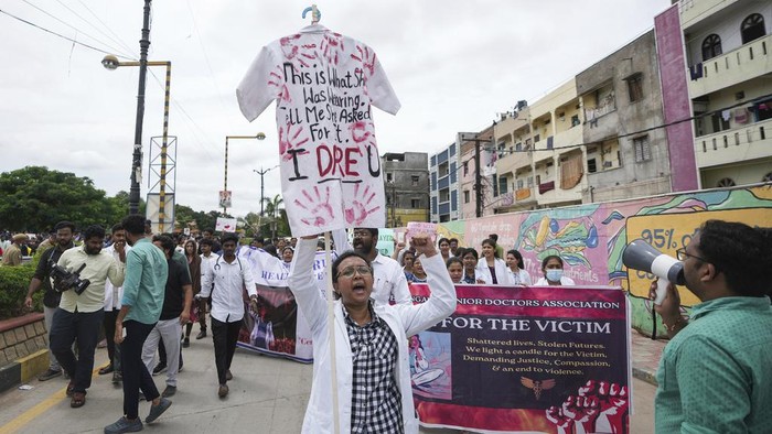 Doctors protesting against the alleged rape and killing of a trainee doctor at a government hospital in Kolkata, hold placards during a protest rally in Hyderabad, India, Thursday, Aug.22, 2024. (AP Photo/Mahesh Kumar A.)