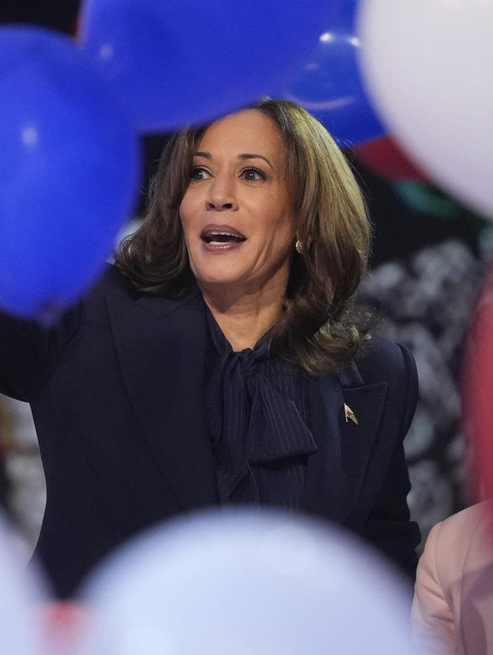 Kamala Harris Democratic presidential nominee Vice President Kamala Harris celebrates with her families as the balloons fall during the final day of during the Democratic National Convention Thursday, Aug. 22, 2024, in Chicago. (AP Photo/Erin Hooley)