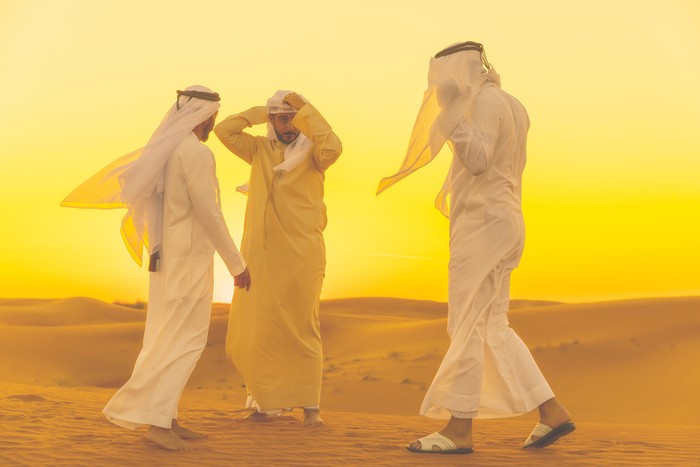 Brotherhood, Friends, Arabs, Dubai - Arab Friends standings on a sand dune and having a casual arguments