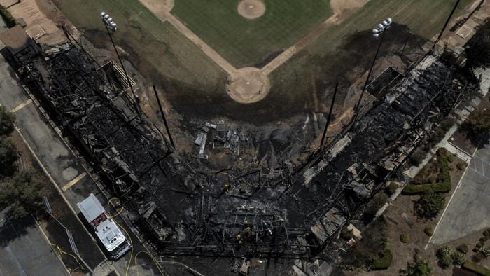 An aerial view shows the aftermath of a fire at Jay Littleton Ball Park, a historic baseball field that appeared in 