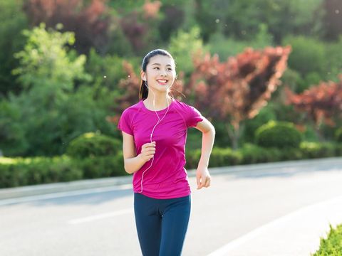 sport woman with mp3 player listening to music