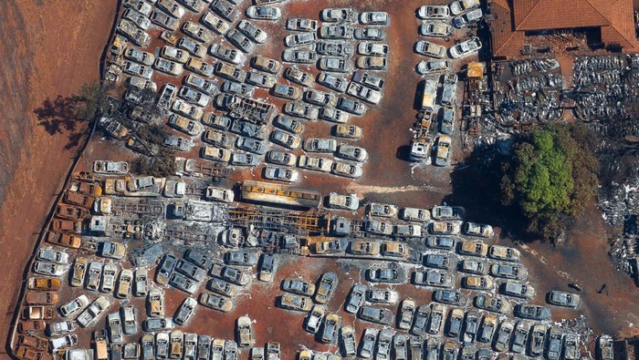 A drone view shows burned cars in a warehouse for vehicles seized by the police, after fires in sugar cane plantations near Dumont city, Sao Paulo state, Brazil, August 26, 2024. REUTERS/Joel Silva
