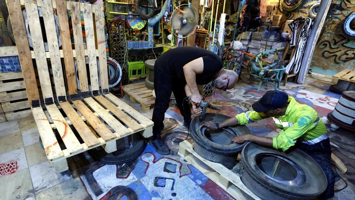 Egyptian entrepreneur Ibrahim Abougendy, owner of Mobikya, sits on a bed recycled out of industrial waste called 