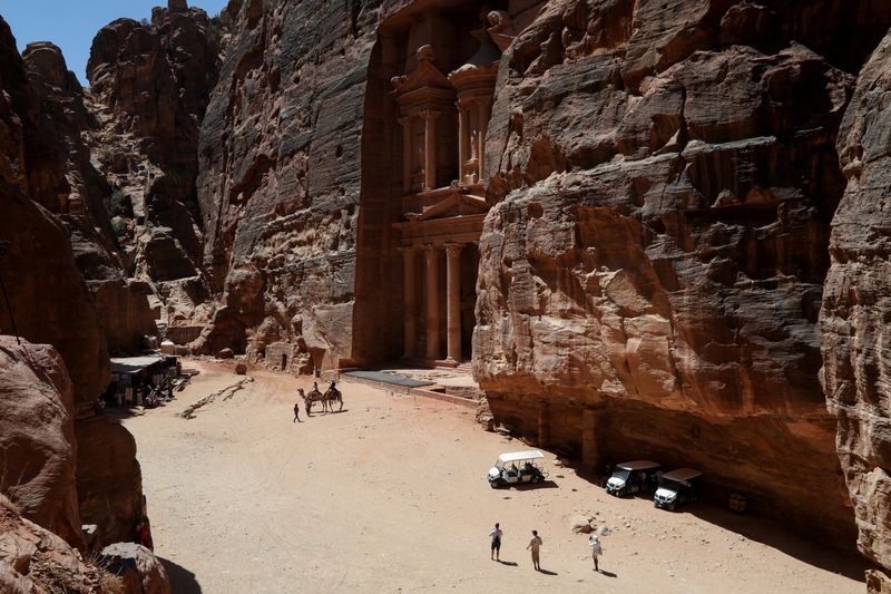 Visitors walk in the ancient city of Petra, south of Amman, Jordan, August 25, 2024. REUTERS/Alaa Al Sukhni