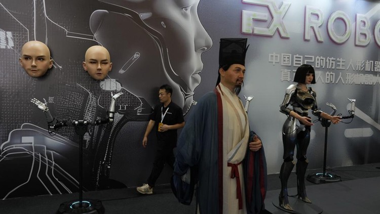 Humanoid robots perform in synchrony at the World Robot Conference held in Beijing, Wednesday, Aug. 21, 2024. (AP Photo/Ng Han Guan)