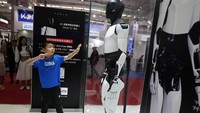 Humanoid robots perform in synchrony at the World Robot Conference held in Beijing, Wednesday, Aug. 21, 2024. (AP Photo/Ng Han Guan)
