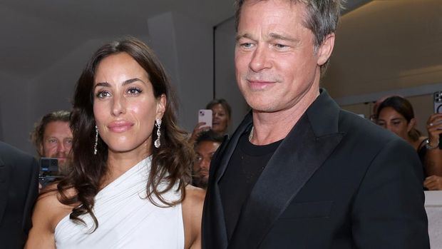 VENICE, ITALY - SEPTEMBER 01: Ines de Ramon and Brad Pitt attend the 