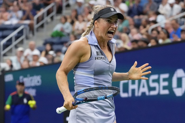 Yulia Putintseva, of Kazakhstan, returns a shot to Jasmine Paolini, of Italy, during the third round of the U.S. Open tennis championships, Saturday, Aug. 31, 2024, in New York. (AP Photo/Kirsty Wigglesworth)