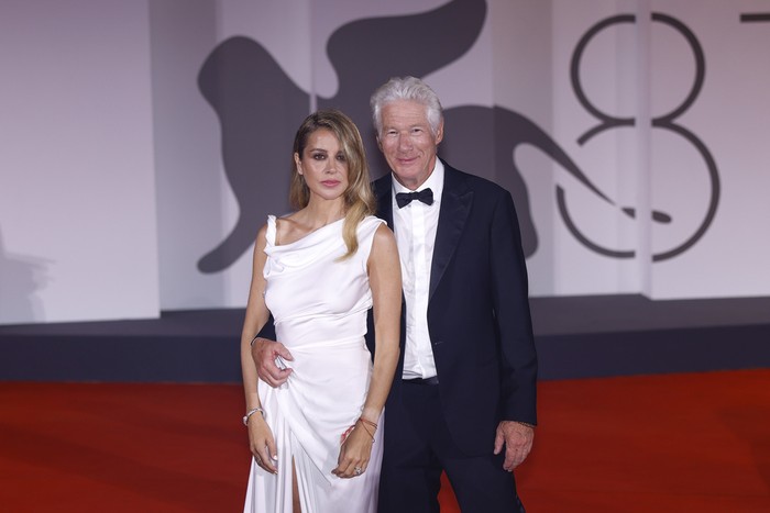 Alejandra Silva, left, and Richard Gere pose for photographers upon arrival for the premiere of the film 'Wolfs' during the 81st edition of the Venice Film Festival in Venice, Italy, on Sunday, Sept. 1, 2024. (Photo by Vianney Le Caer/Invision/AP)