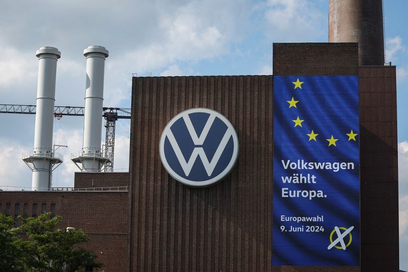 The lettering Volkswagen chooses Europe. Europe votes on 9 June 2024 is seen on the wall of the power plant at the headquarters of German car maker Volkswagen (VW) in Wolfsburg on May 23, 2024. The 2024 European Parliament election is scheduled to be held on 6 to 9 June 2024. (Photo by RONNY HARTMANN / AFP)
