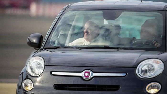 Pope Francis on a wheelchair boards his flight to Asia at Rome's Leonardo Da Vinci International airport in Fiumicino, some 30 kilometers west of Rome, Monday, Sept. 2, 2024. Francis will clock 32,814 kilometers (20,390 miles) by air during his Sept. 2-13 visit to Indonesia, Papua New Guinea, East Timor and Singapore, far surpassing any of his previous 44 foreign trips and notching one of the longest papal trips ever, both in terms of days on the road and distances traveled. (AP Photo/Andrew Medichini)