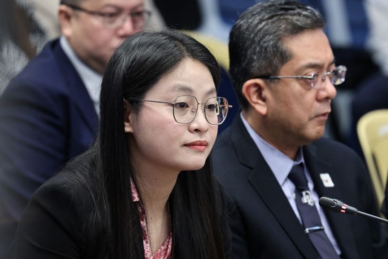 In this handout photo taken on June 25, 2024 and received on July 18, 2024 from the Senate of the Philippines, mayor Alice Leal Guo (L) of Bamban, province of Tarlac, attends a hearing at the Senate in Manila. (Photo by Handout / SENATE OF THE PHILIPPINES / AFP) / -----EDITORS NOTE --- RESTRICTED TO EDITORIAL USE - MANDATORY CREDIT 
