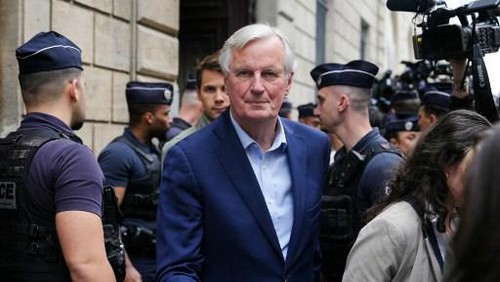 French politician and former European Union chief negotiator Michel Barnier leaves after  an emergency executive board meeting called by French right-wing party Les Republicains (LR) vice-president Annie Genevard at the Musee Social in Paris on June 12, 2024. The president of the French right-wing party Les Republicains (LR) is threatened to be expelled after calling for an alliance with French far-right party Rassemblement National (RN), ahead of snap elections for a new National Assembly. (Photo by Dimitar DILKOFF / AFP)