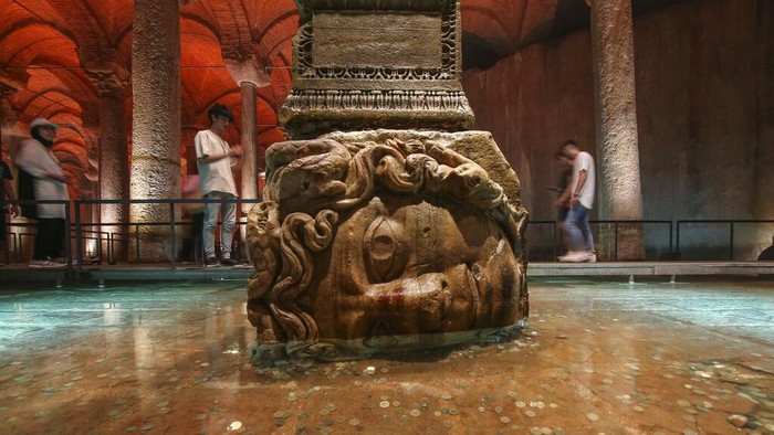 Visitors walk along the Byzantine-era Basilica Cistern in Istanbul, Turkey, Tuesday, Sept. 3, 2024. (AP Photo/Khalil Hamra)